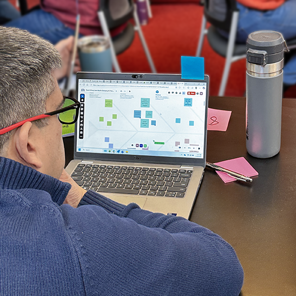 A student in the workshop working on the digital platform, Mural, to build an A3 digitally